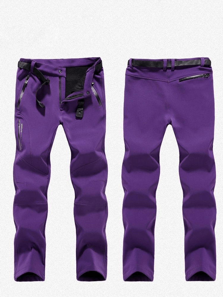 Purple windproof waterproof fleece women's hiking pants with zipper fly, ideal for outdoor adventures like camping and trekking.